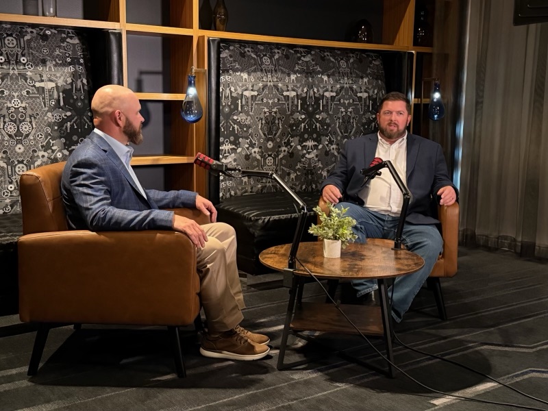 FastBound VP Jamison Collins answering questions in an armchair on the livestream set