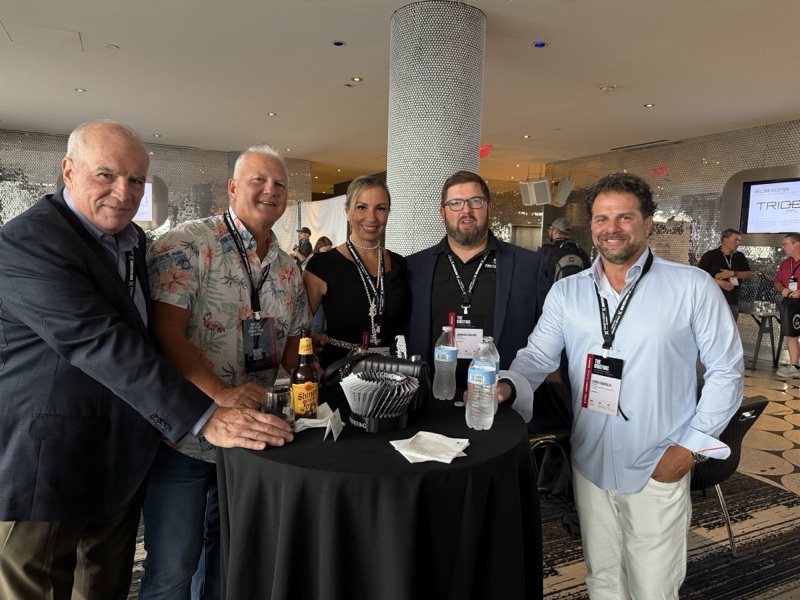 Michael Bouchard, Michael Fronczak, Lauren Chiafullo, Jamison Collins and Chris Chiafullo at a cocktail table during the welcome reception